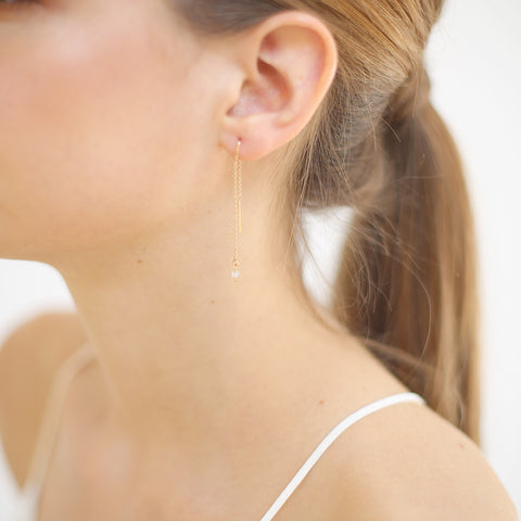 White gemstone dangle earrings