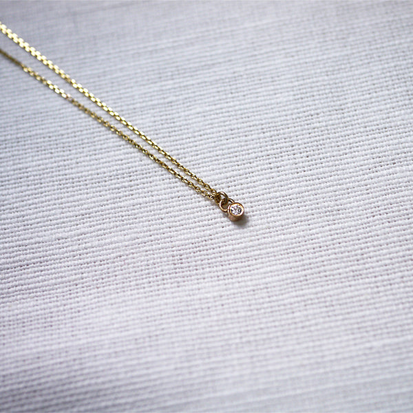 Tiny diamond necklace gold